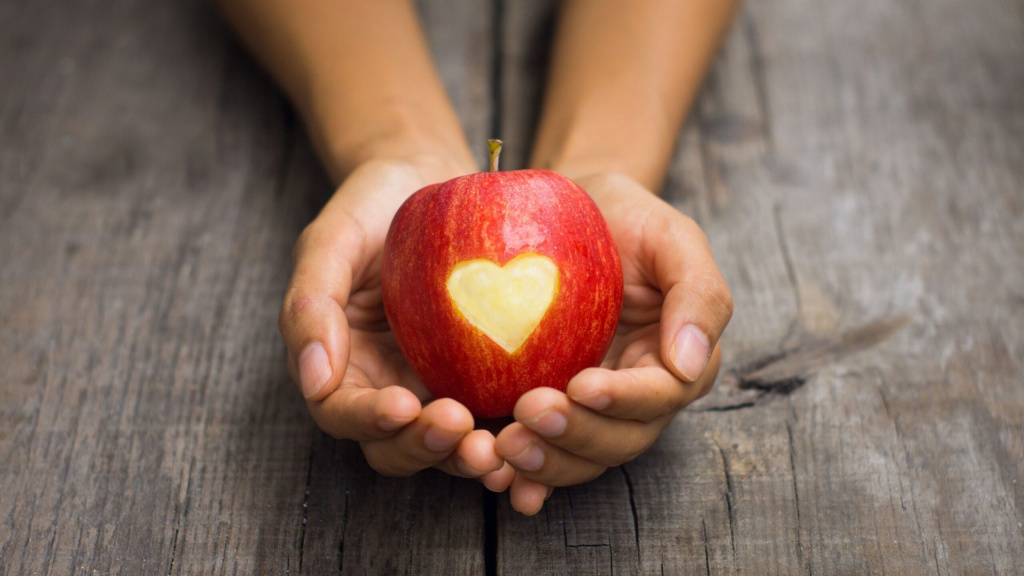 red-apple-in-hand-love-heart-shaped-4K-wallpaper-scaled-1-min.jpeg